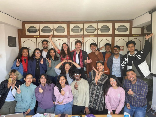 Youth Ambassadors Jim and Laura with members of youth-led organisations in Nepal, with big smiles 